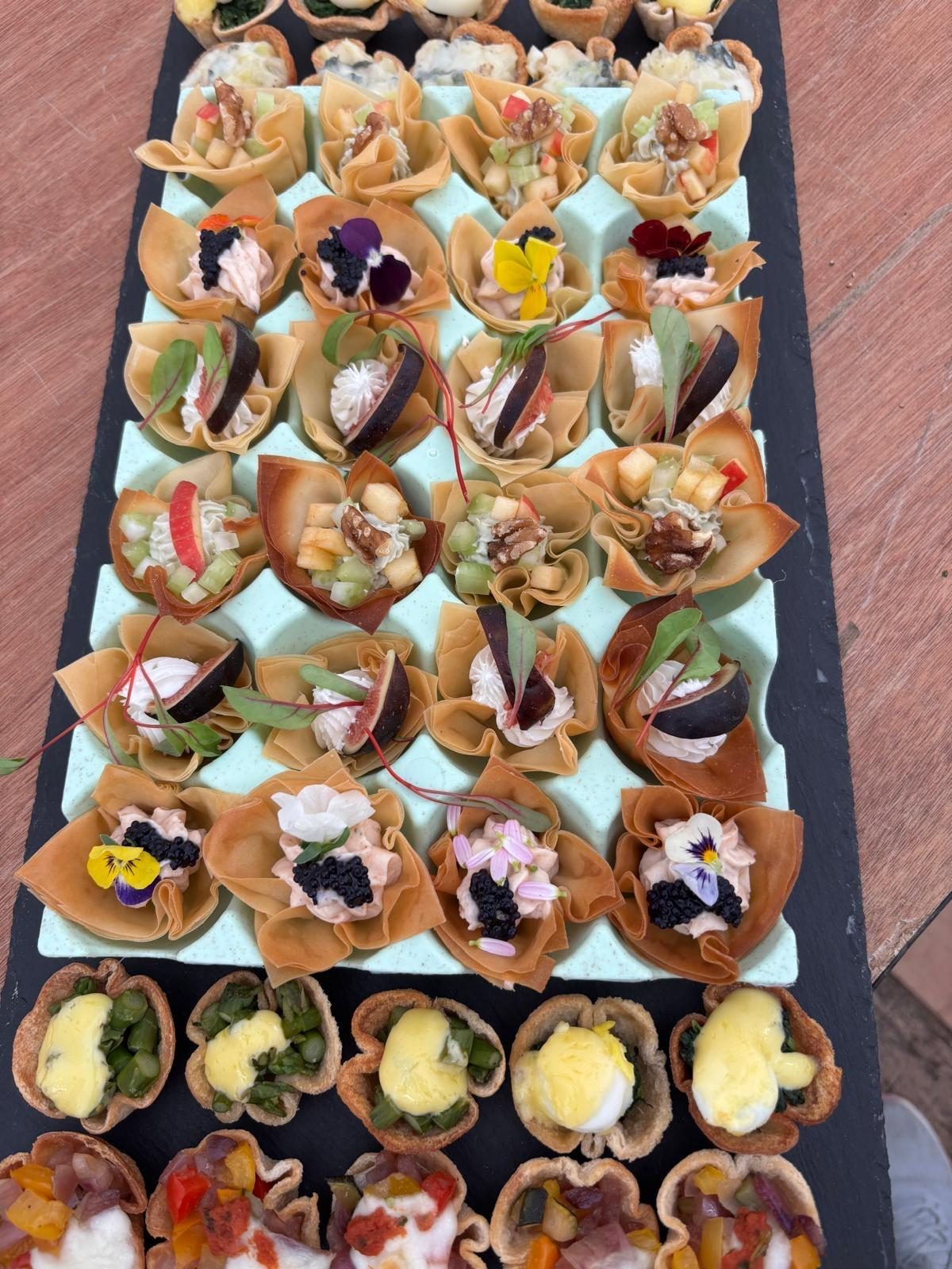 Filo canapes arranged on a table, ready to be served.